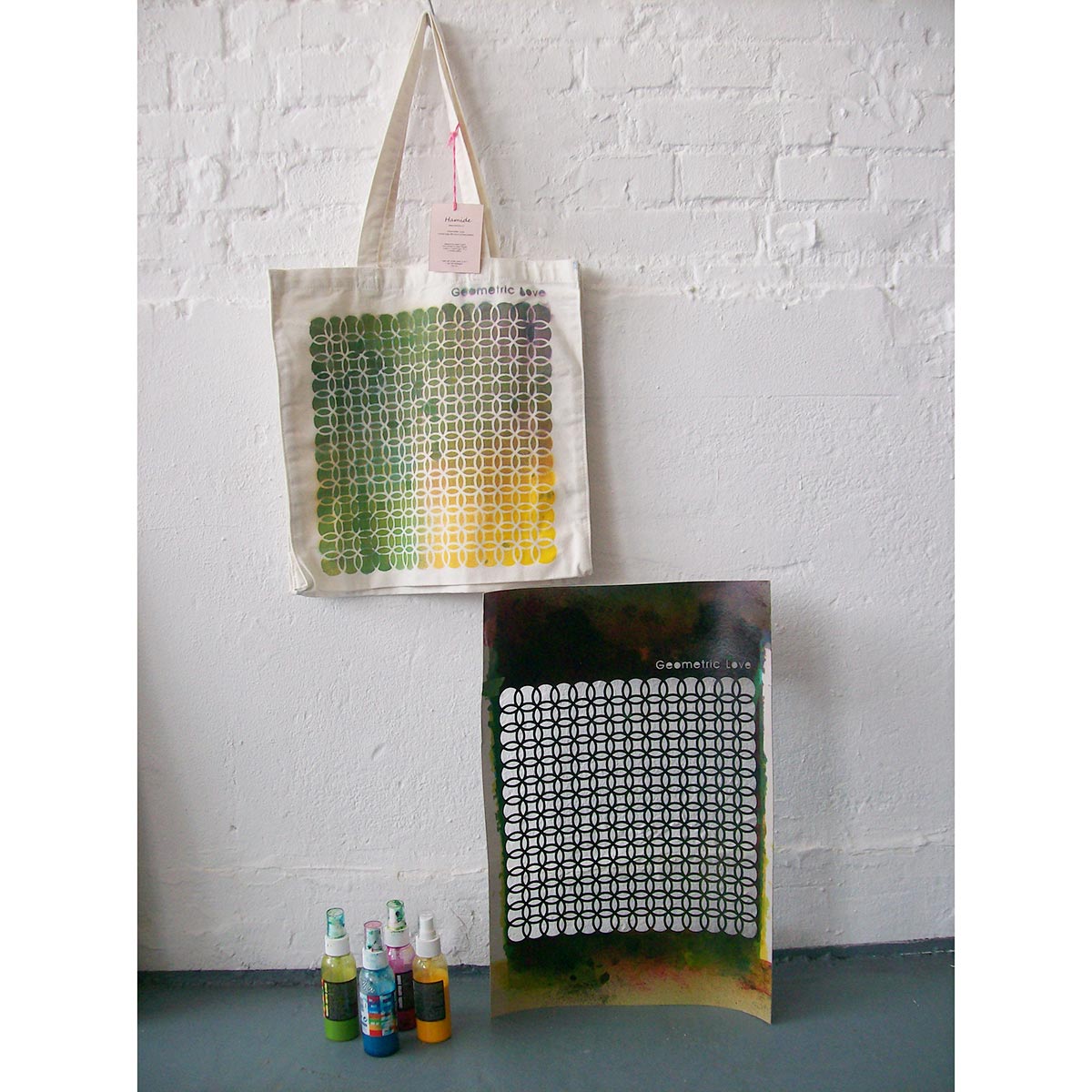 "Geometric Love" canvas bag with the materials used to paint it