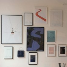Studio wall showing Copenhagen Lamp and many prints together