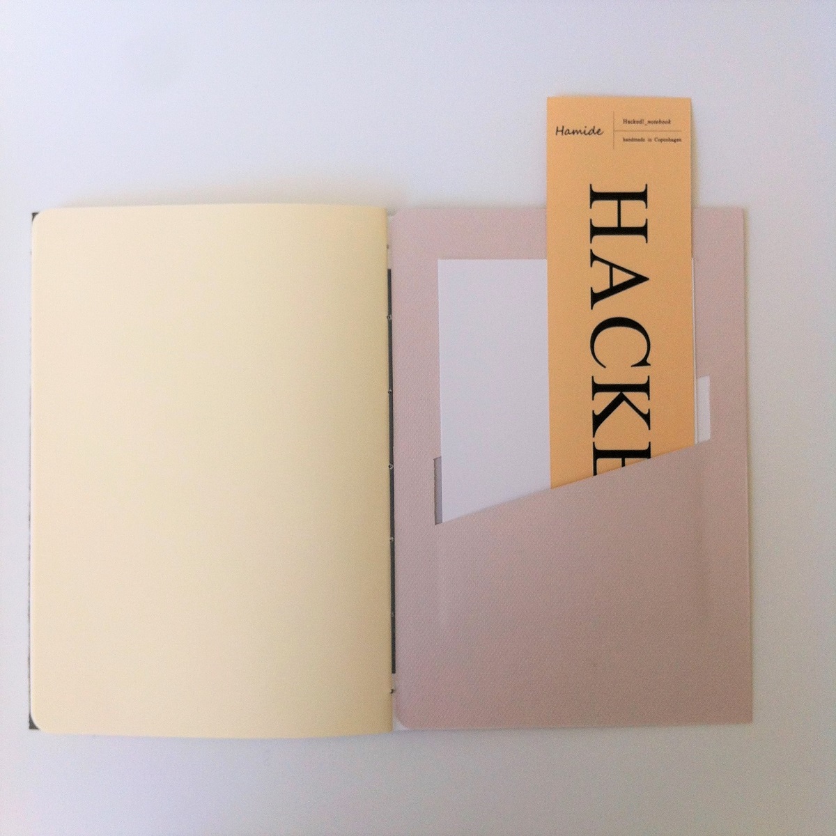 Collaborations-Hacked-Mater-Earth-Gallery-Notebooks-Back-Pocket-Usage-2-Hamide-Design-Studio Pocket usage detail from the Hacked notebook for Mater Earth Gallery