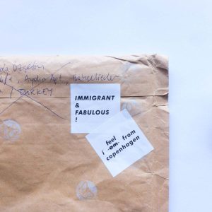 "I Feel From Copenhagen" and "Immigrant & Fabulous!" stickers in use