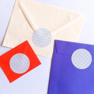 Geometric Love stickers on colorful envelopes