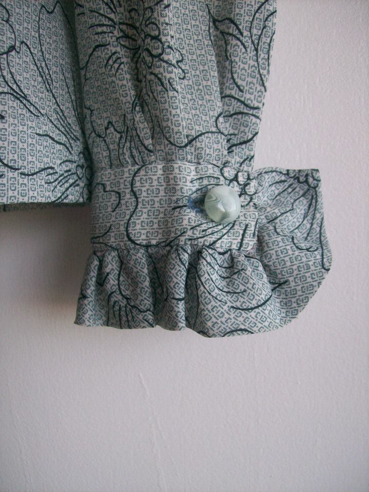 Blog-Originals-Blouse-Grey-Flowers-Ruffles-Arm-Hamide-Design-Studio Arm detail from the white blouse from Hamide's Originals series