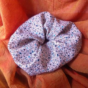 Handmade, limited edition scrunchie made out of leftover vintage fabric with floral print