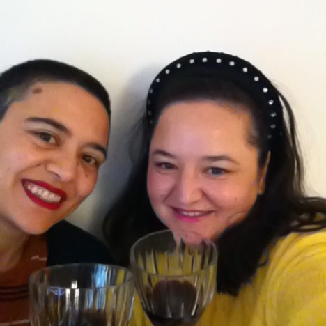 Seda and Seyda in a selfie saying cheers with wine