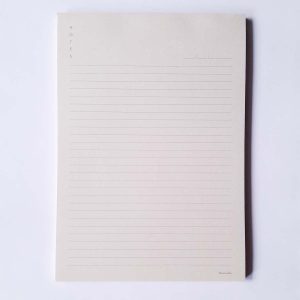 Ruled Hamide Basics notepad in light peach background in A6 size