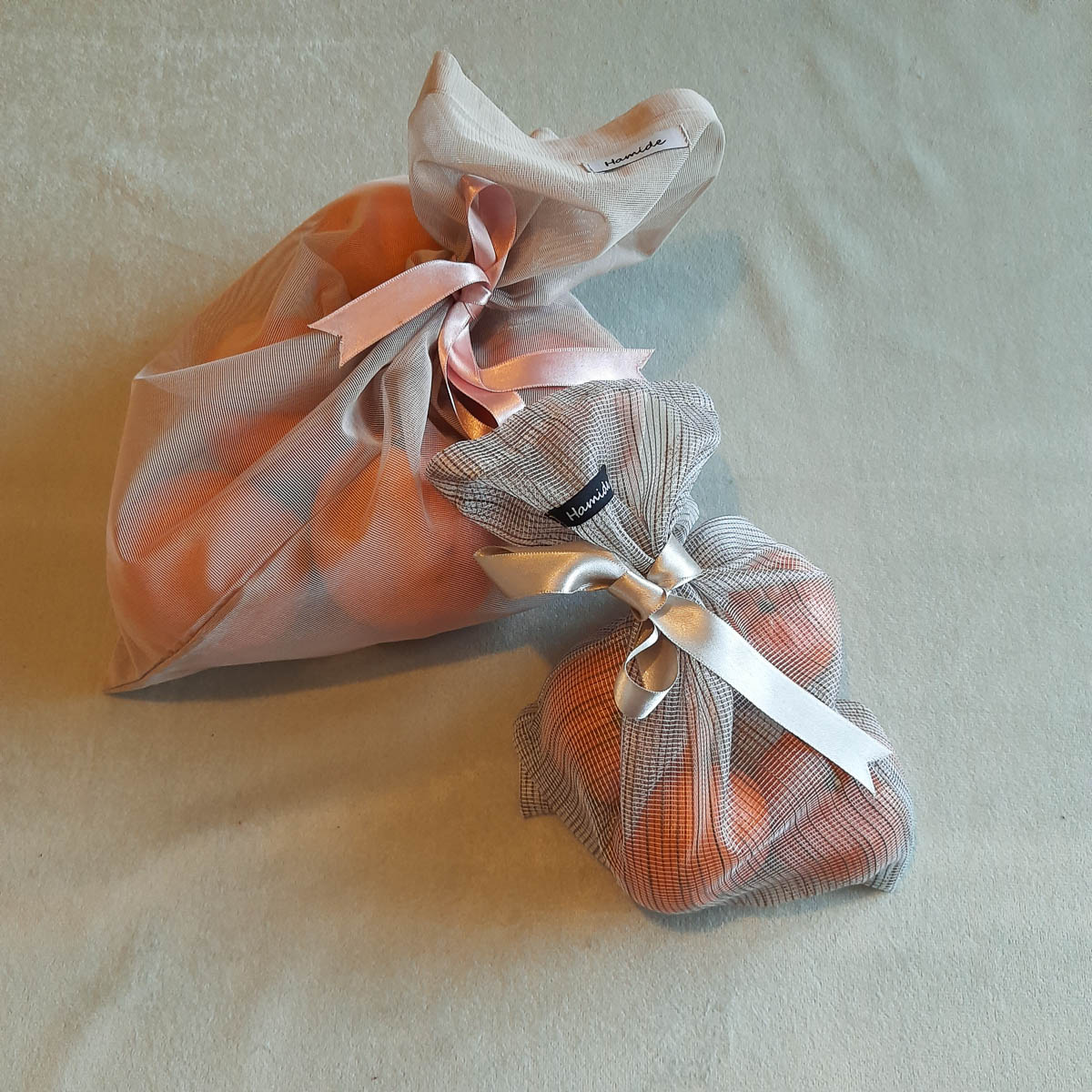 Collections-Originals-Tulle-Sacs-Editorial-Usage-Hamide-Design-Studio Two size of Hamide Original Tulle Sacs presented bearing fruits