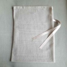 Front of large reusable tulle sac in cream for shopping groceries