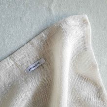 Texture of large reusable tulle sac in cream for shopping groceries