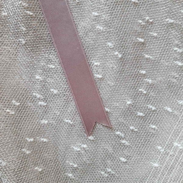 Texture of large reusable tulle sac in gradient brown for shopping groceries