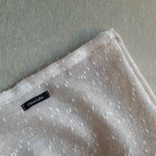 Texture of large reusable tulle sac in gradient brown for shopping groceries