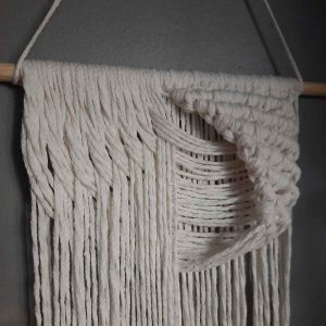 Close-up view of the relief effect in the macrame wall hanging