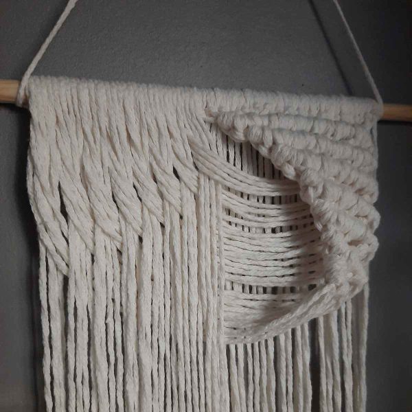 Close-up view of the relief effect in the macrame wall hanging