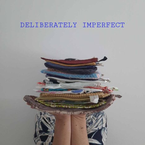 Co-founder and Art director of Hamide Design Studio holding a series of deliberately imperfect potholders
