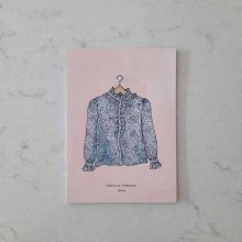 Postcard featuring a handmade shirt designed and made by our honorary founder and mother Hamide